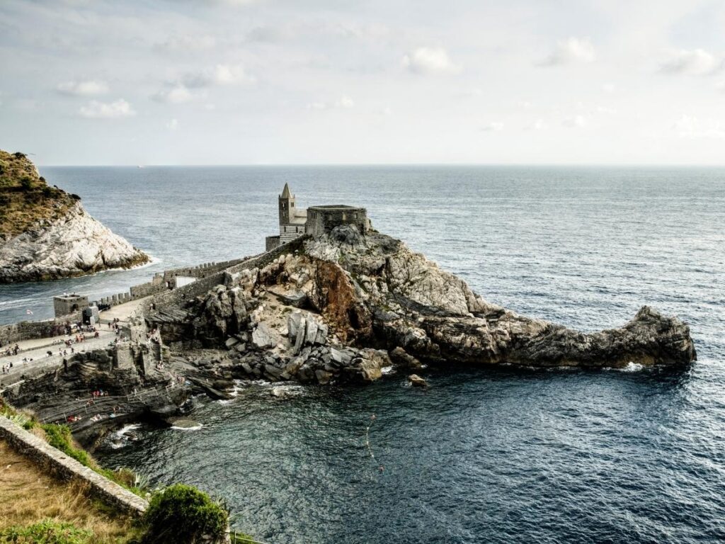 Portovenere shoreline with the Church of San Pietro perched on the rocks.