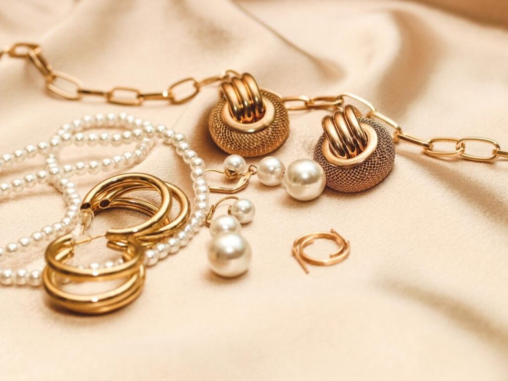 Jewelry scattered on hotel nightstand, showing risk of packing valuable accessories