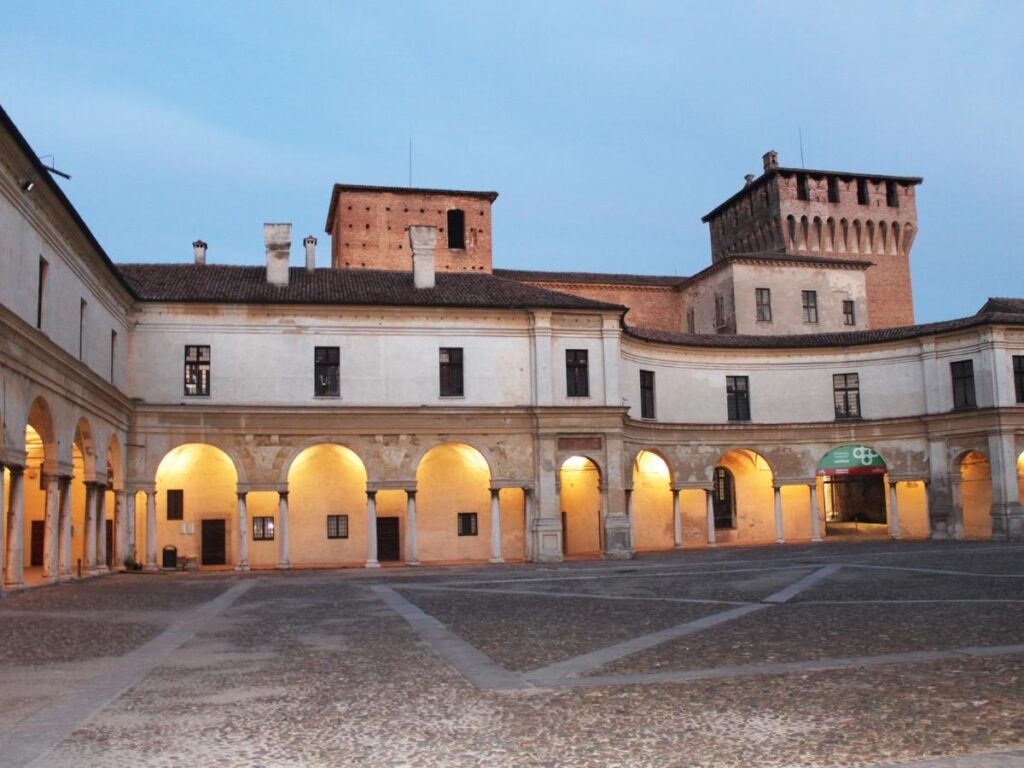 Facade of Mantua’s Palazzo Ducale with a quiet piazza in front.