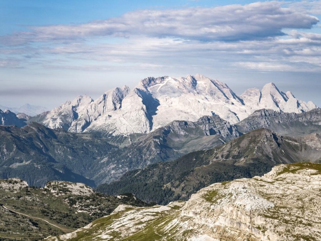 Panoramic view from Marmolada glacier with snow-covered peaks in the Dolomites.