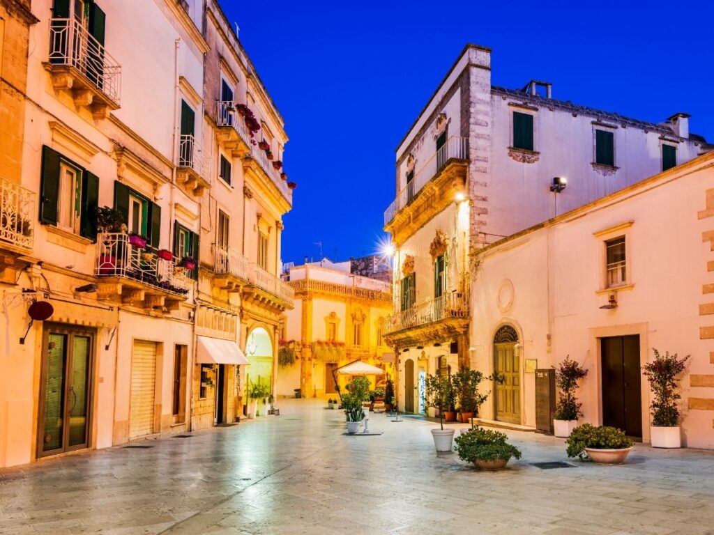 Outdoor café in Martina Franca’s old town during aperitivo hour.