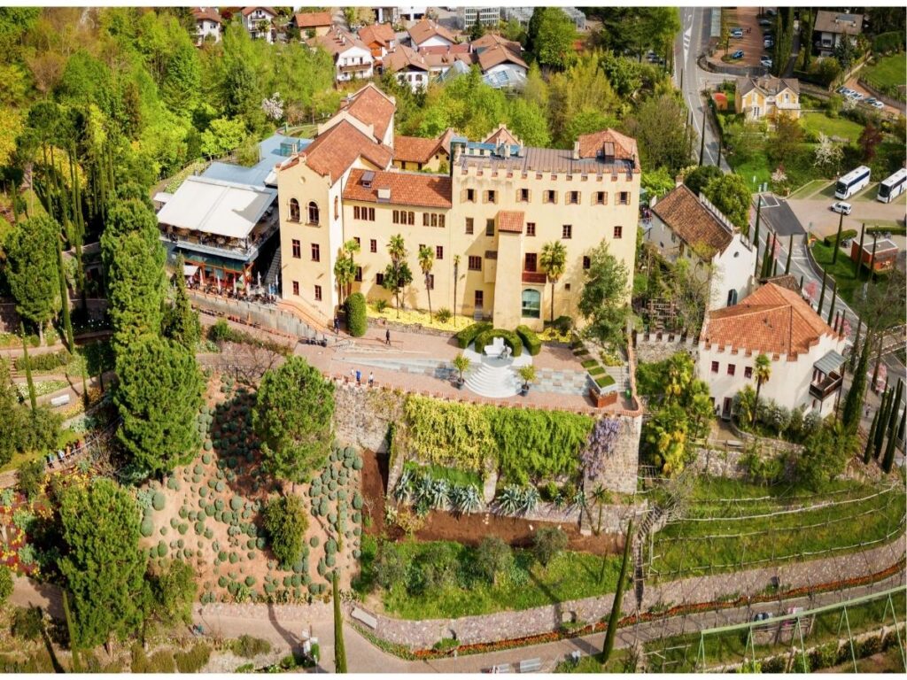Flower beds and terraces at Trauttmansdorff Castle gardens in Merano with panoramic views
