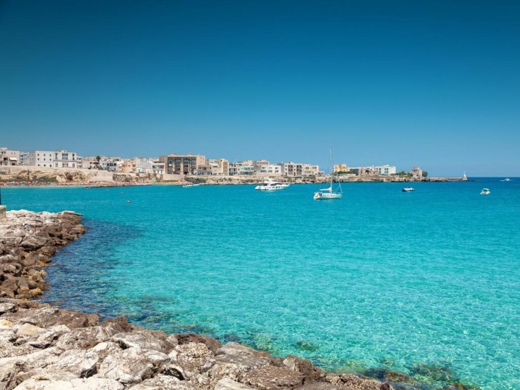 Otranto harbor and turquoise waters of the Salento coast.