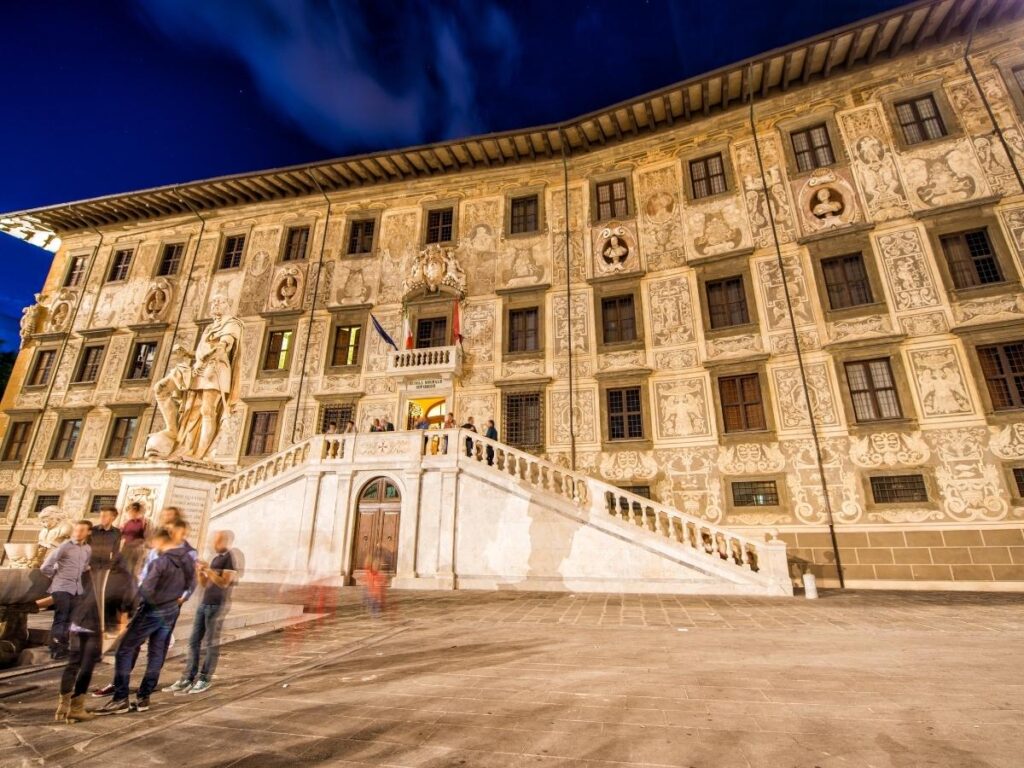 Wide view of Piazza dei Cavalieri with Palazzo della Carovana in Pisa
