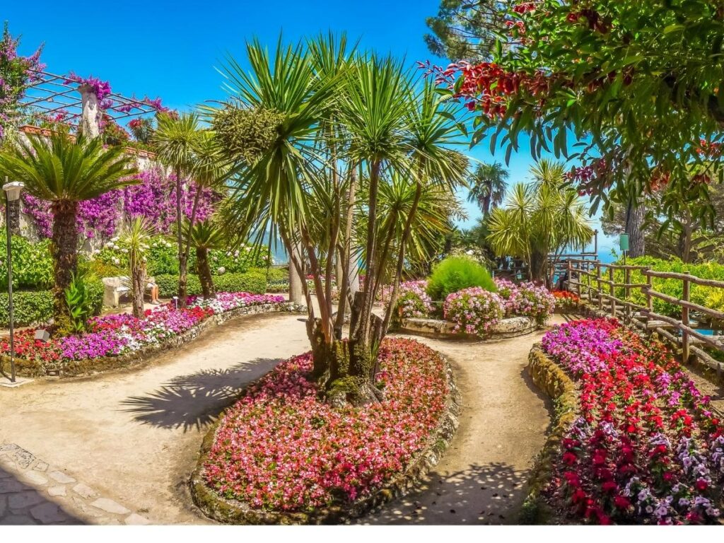 Colorful gardens of Villa Rufolo with sea views in Ravello.