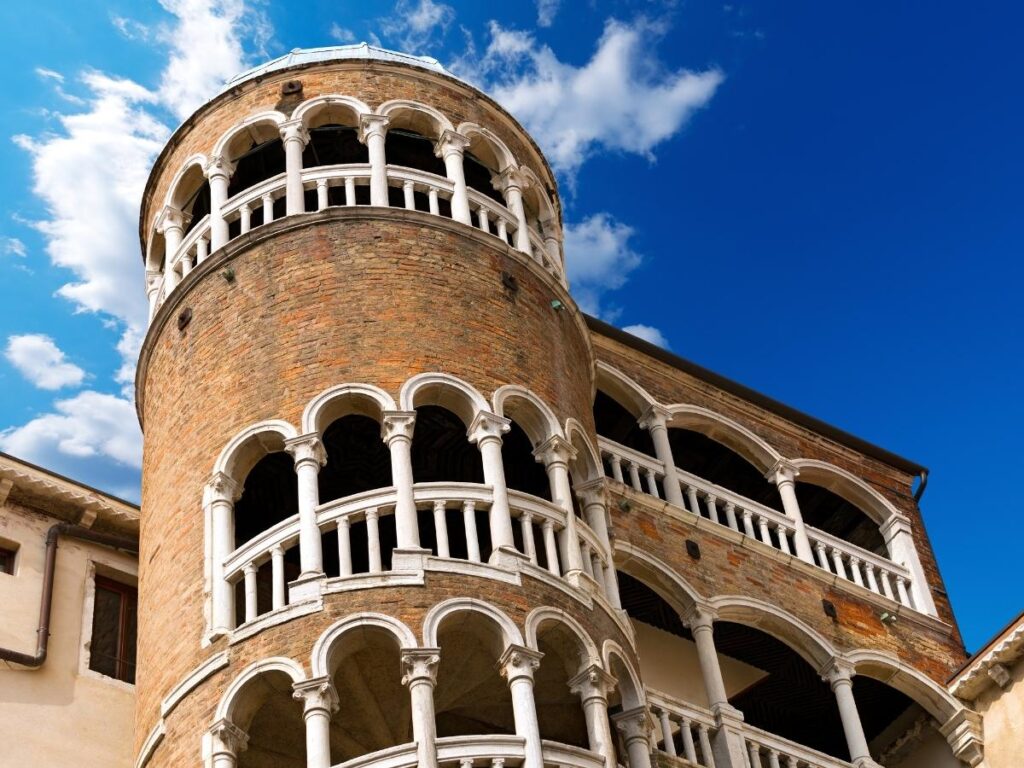Spiral staircase of Scala Contarini del Bovolo leading to rooftop views of Venice