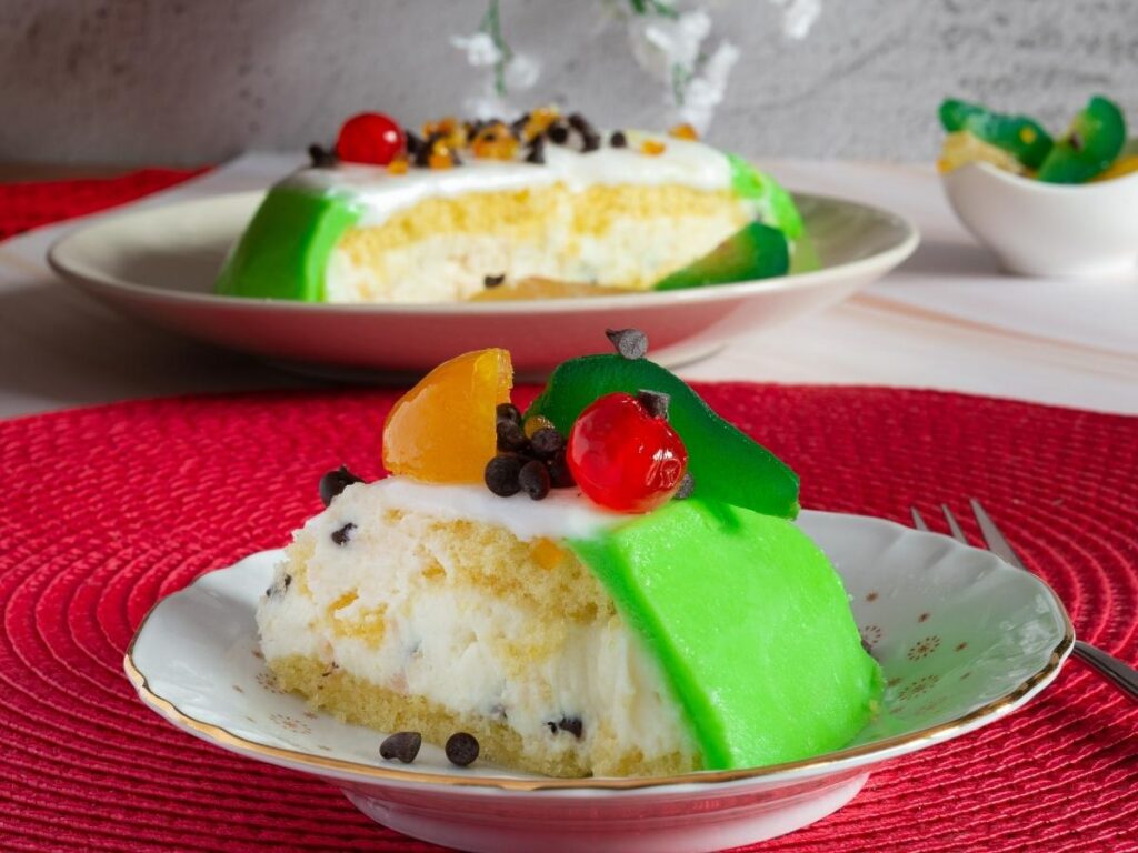 Traditional Sicilian cassata with layers of sponge, ricotta, and candied fruit on display