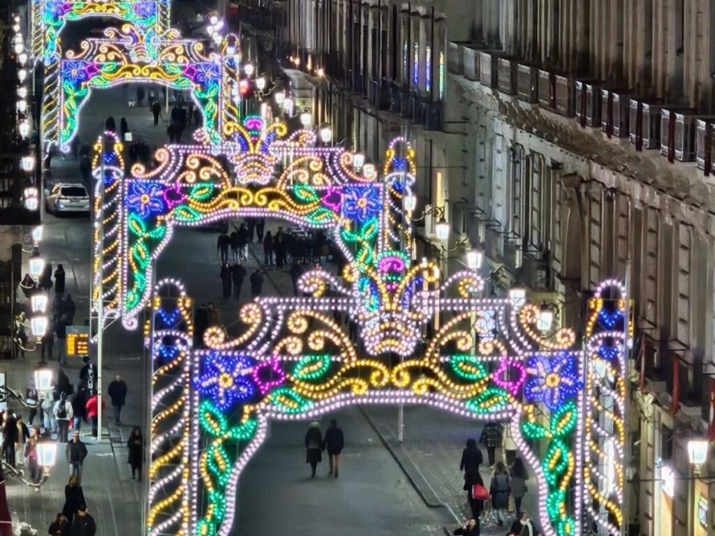Procession during the Feast of Sant’Agata in Catania with fireworks and decorated floats.