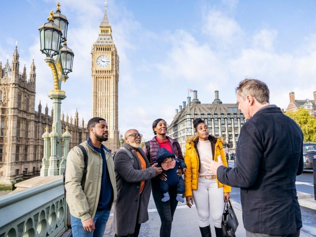 Small walking tour group exploring historic streets with a local guide
