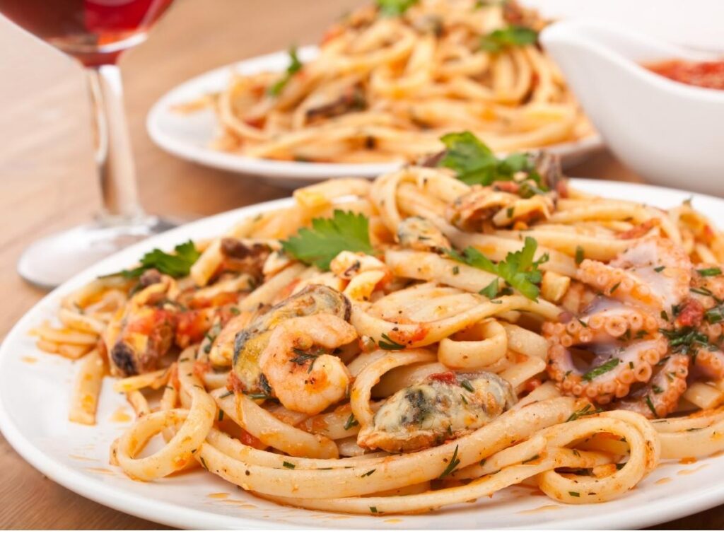 Plate of spaghetti alle vongole served at a seaside trattoria in Sorrento.