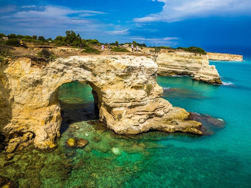 Wide sandy beach and shallow waters at Torre dell’Orso in Apulia.