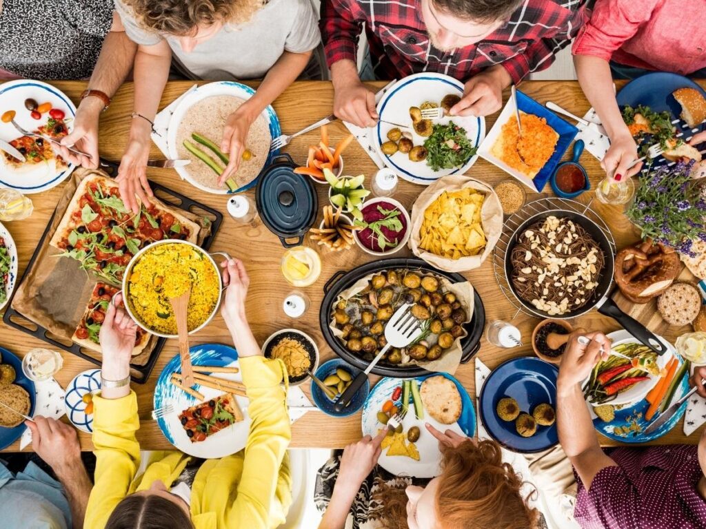 Tour group sharing a meal at a family-owned restaurant with traditional dishes.