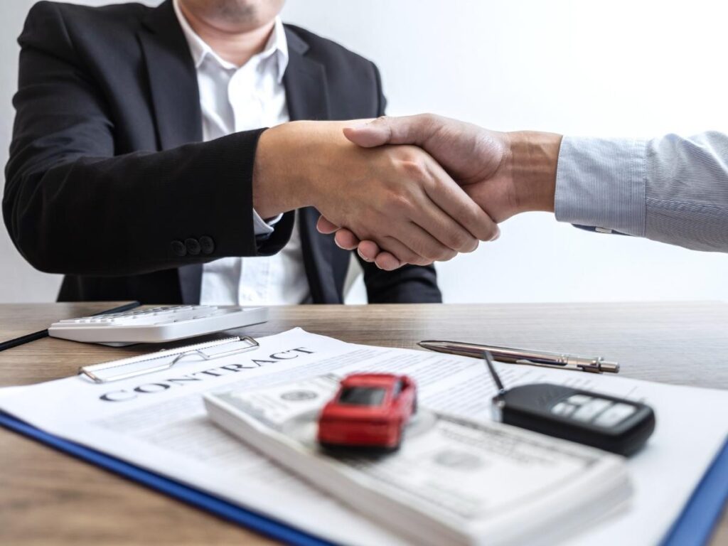 Car rental desk offering extra insurance coverage to tourists