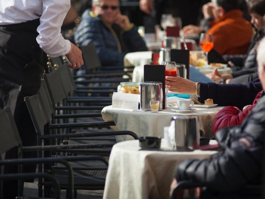 Small espresso cup on a saucer at an outdoor café table in Trieste.”