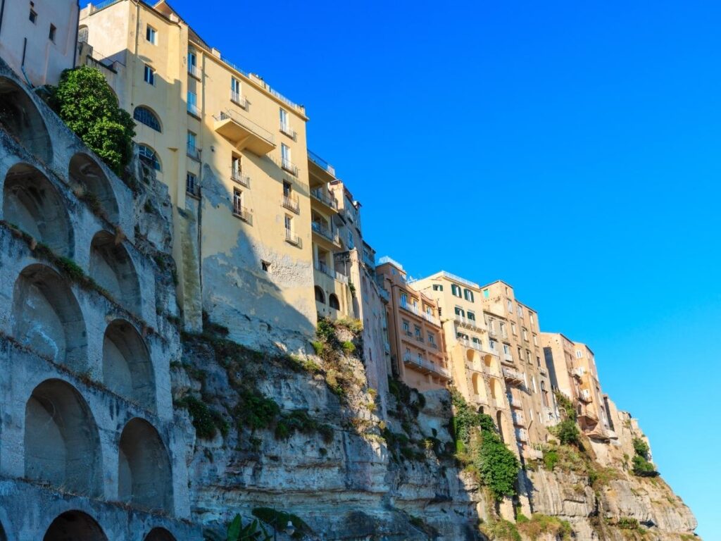View of Tropea old town perched on cliffs above the Tyrrhenian Sea in Calabria.