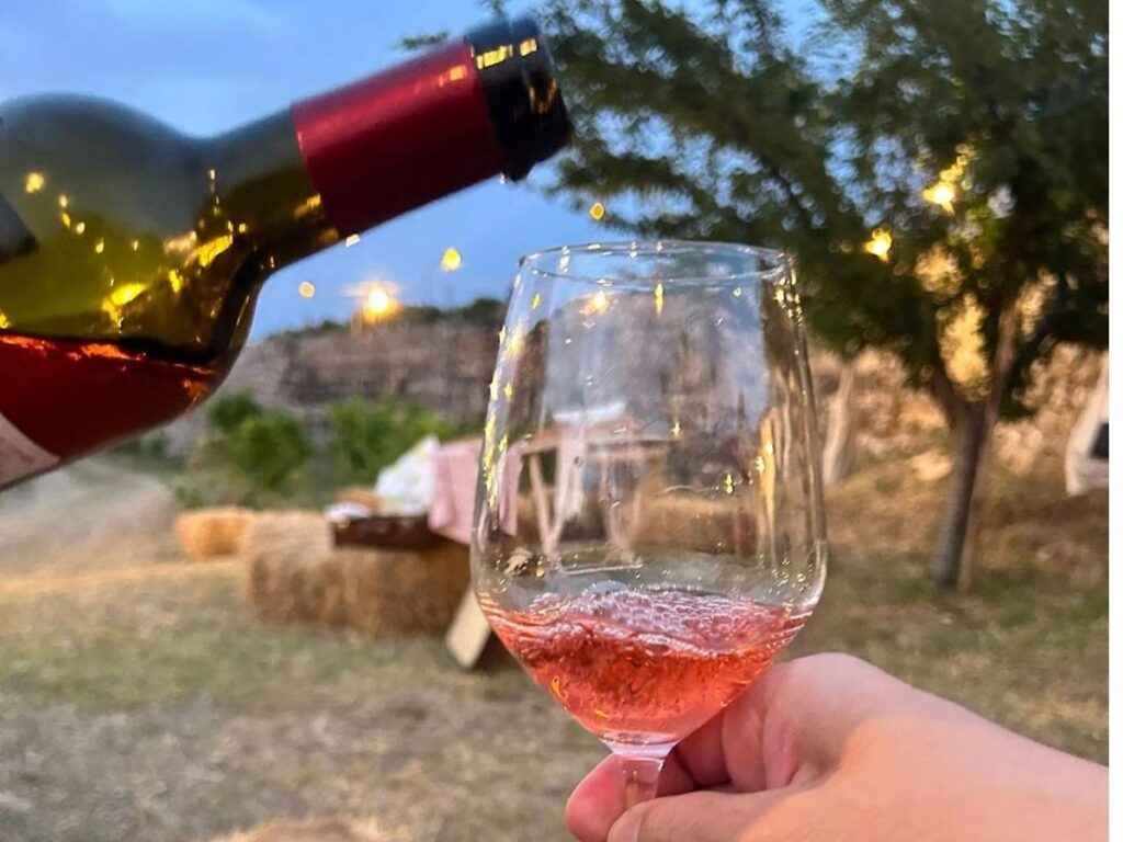 Wine tasting setup with Locorotondo DOC white wines and local cheeses