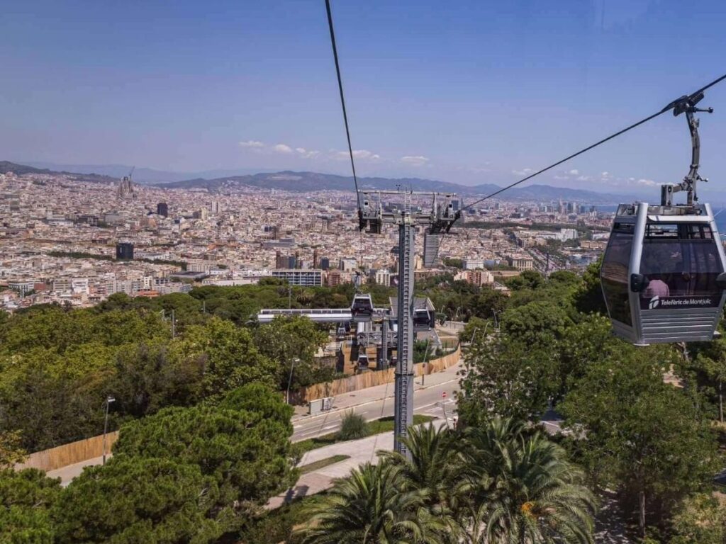 Cable car crossing toward Montjuïc with sea view