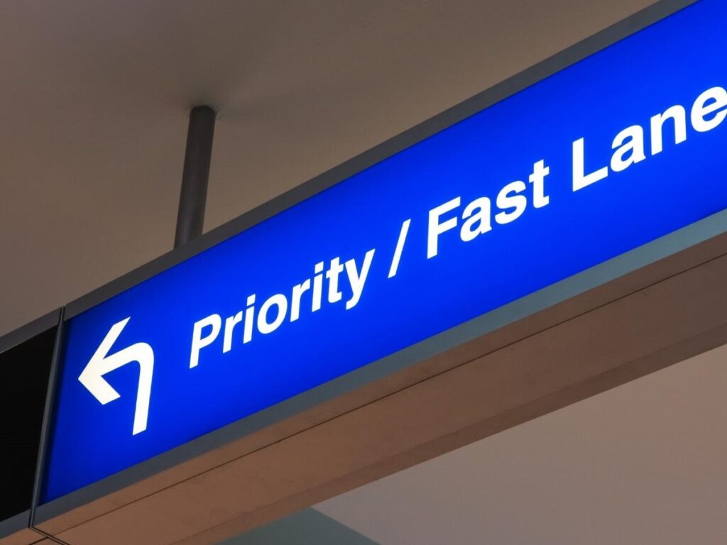 Priority security lane at airport with traveler using fast track access