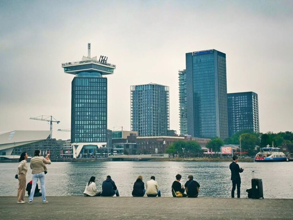 Large mural and industrial warehouses at NDSM Wharf in Amsterdam Noord.