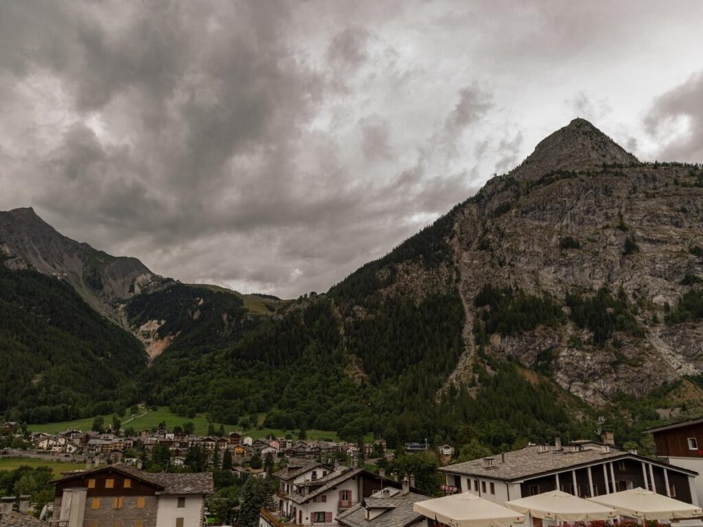 Courmayeur town with stone streets and Mont Blanc massif rising behind.