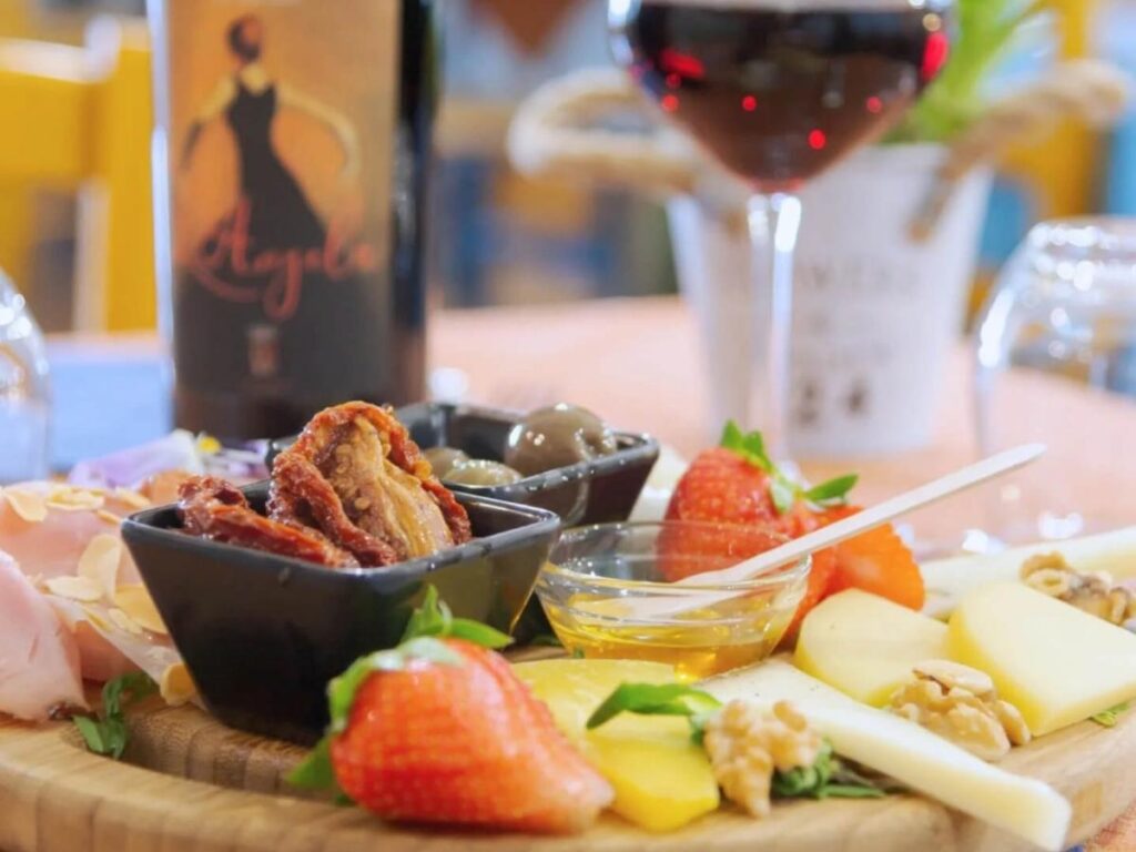 Aperitivo drinks and small plates at a café in Piazza Vittorio Veneto.