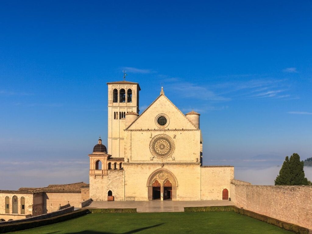 Basilica di San Francesco in Assisi glowing at sunset