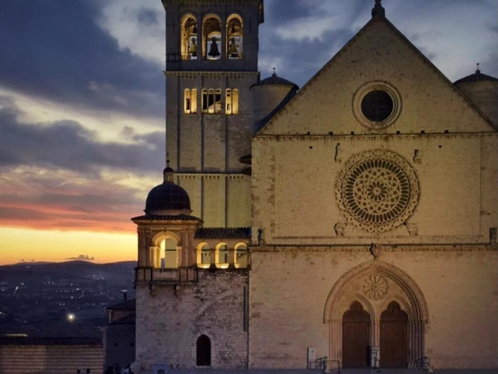 Assisi at dusk with the Basilica softly lit and empty cobbled streets