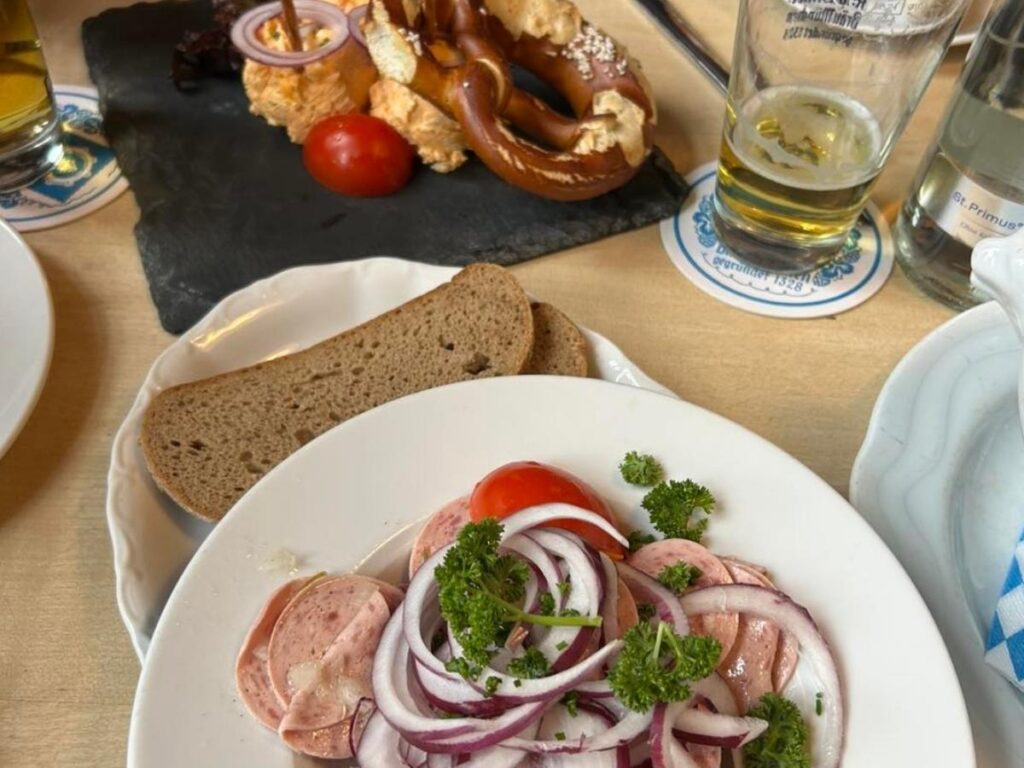 Crispy schnitzel with lemon slice and potato salad at Augustiner-Keller beer garden in Munich