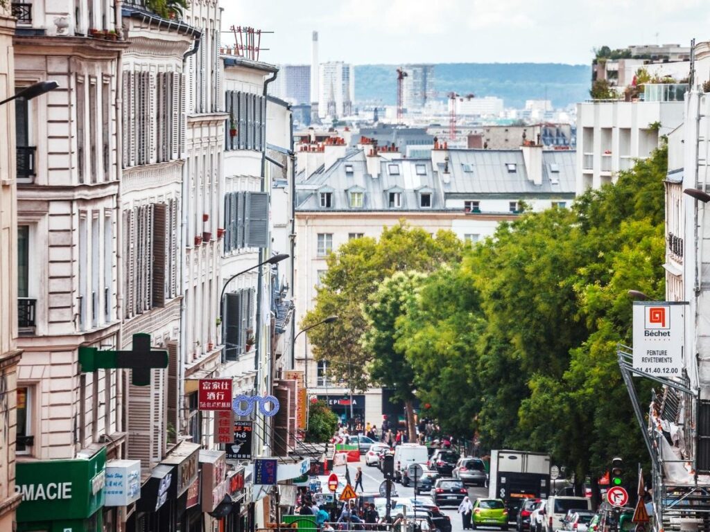 Street art murals and city skyline view from Belleville hill in Paris