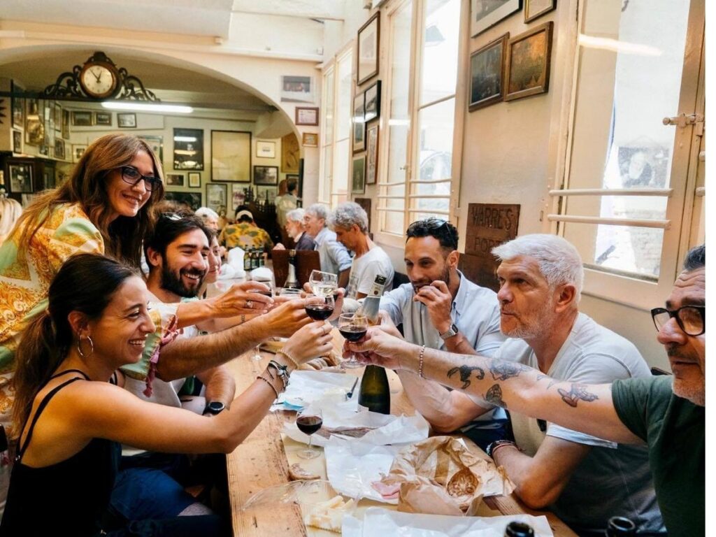 Two glasses of sparkling Lambrusco wine on a table at an osteria in Bologna.”