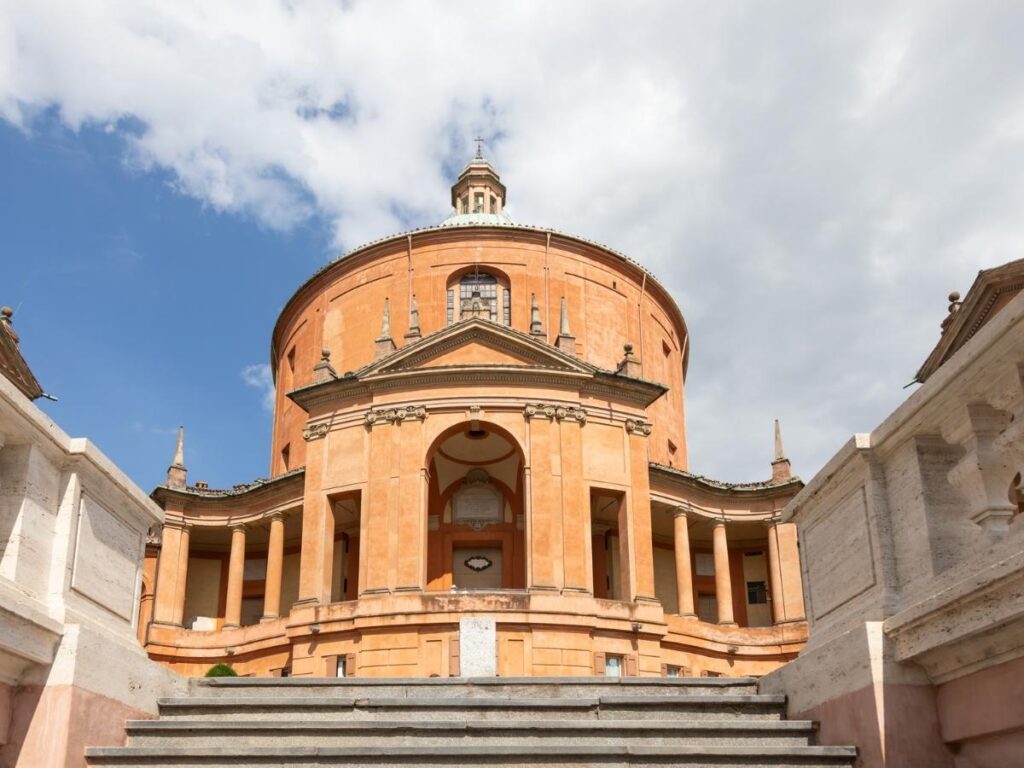 View over Bologna’s terracotta rooftops from the Sanctuary of San Luca at sunset