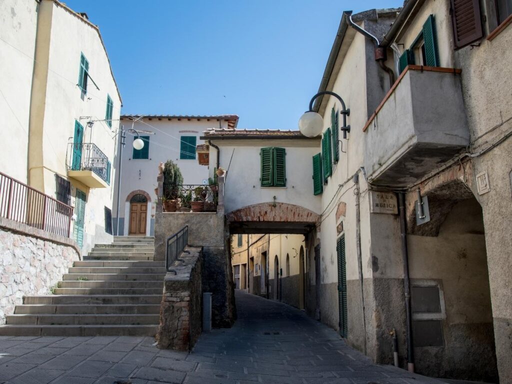 Cobblestone lane and timbered façade at the Borgo Medievale in Turin