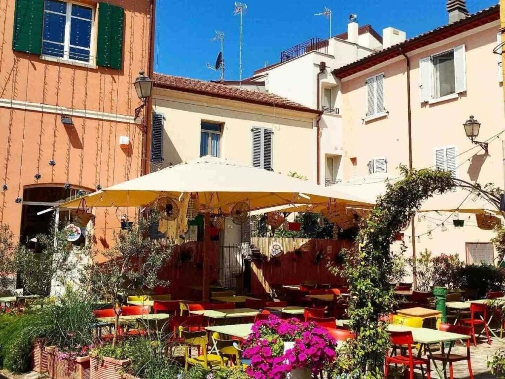 Street murals inspired by Federico Fellini’s films in Borgo San Giuliano, Rimini.