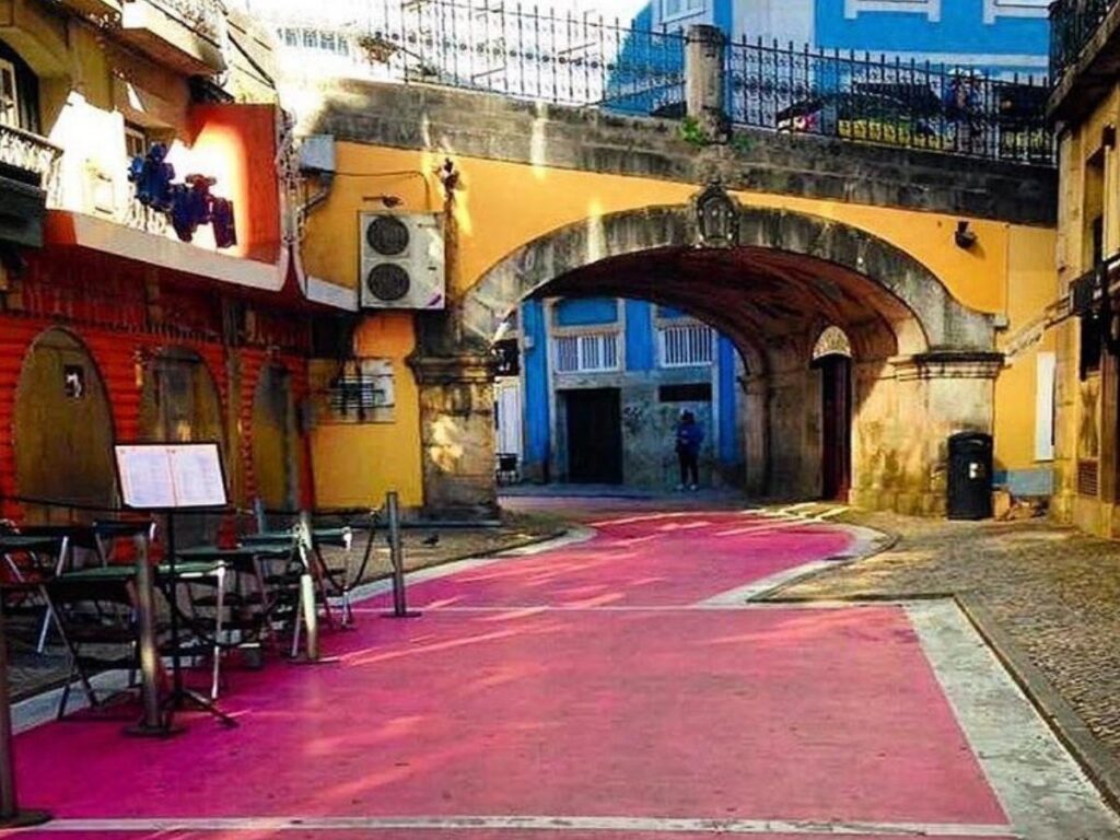 Neon lights along Lisbon’s Pink Street in Cais do Sodré glowing after dark