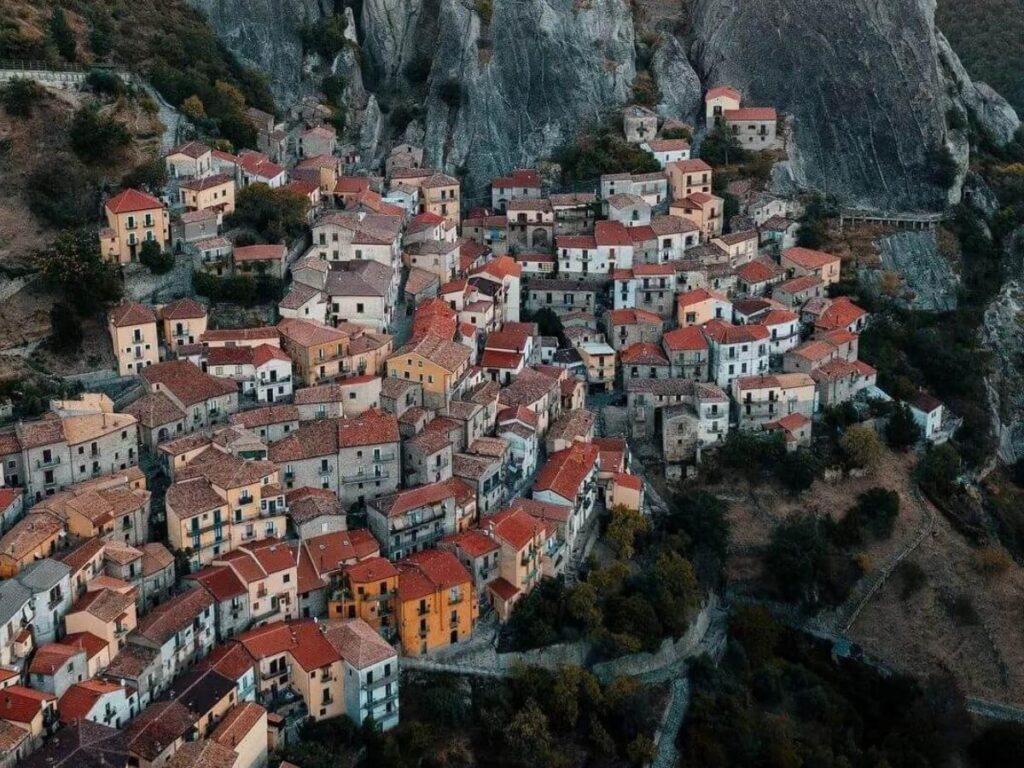 Aerial view of Castelmezzano and Pietrapertosa clinging to the jagged Lucanian Dolomites.