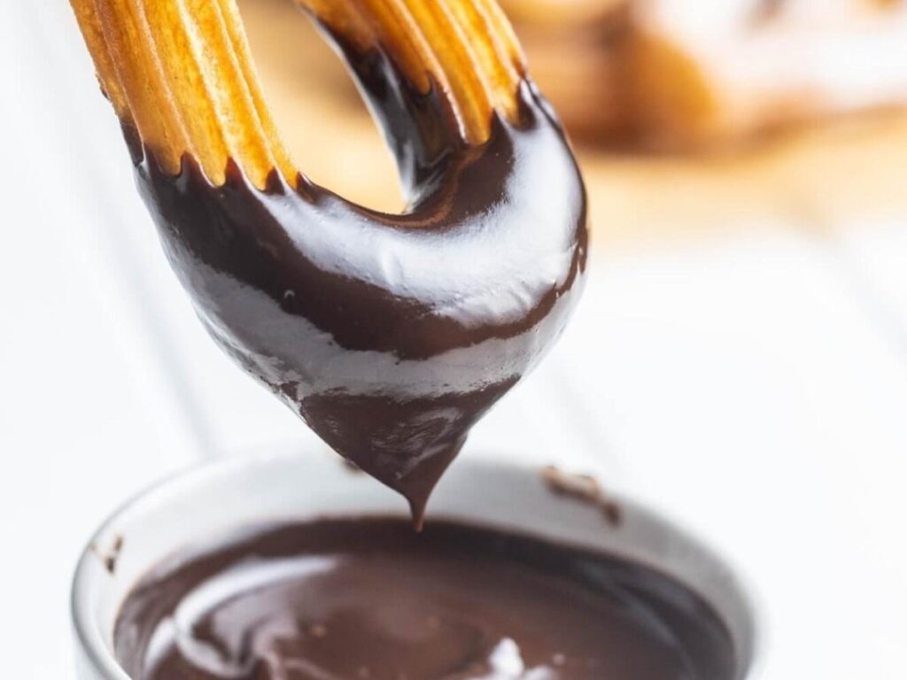 Churros dipped in hot chocolate at Chocolatería San Ginés, Madrid
