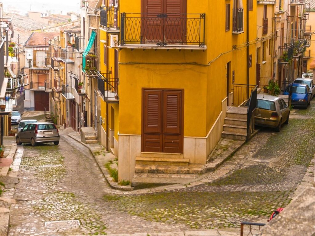 View of Corleone town surrounded by green hills in the Sicilian countryside