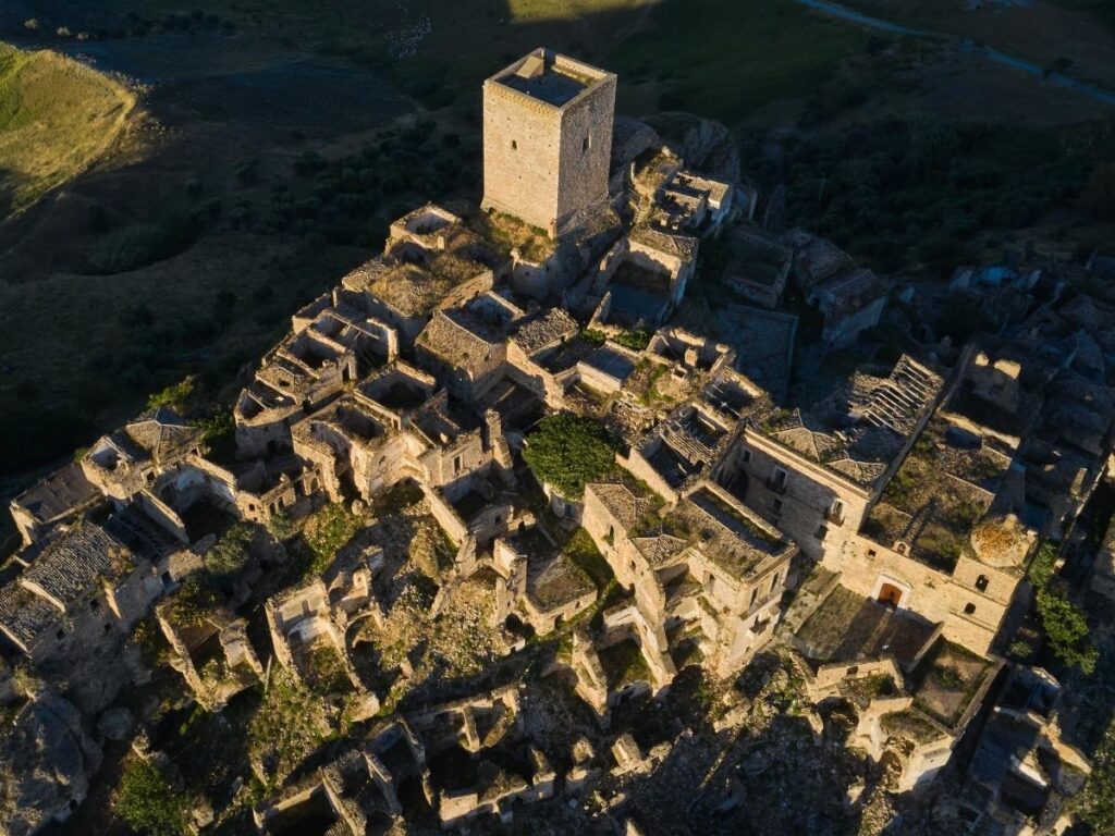 Empty cobbled street and crumbling stone houses in the abandoned town of Craco.