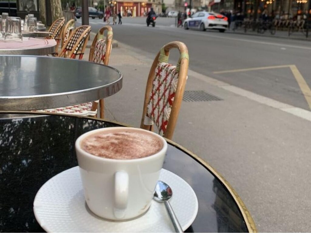 Fresh croissant and espresso served on a café terrace in Paris