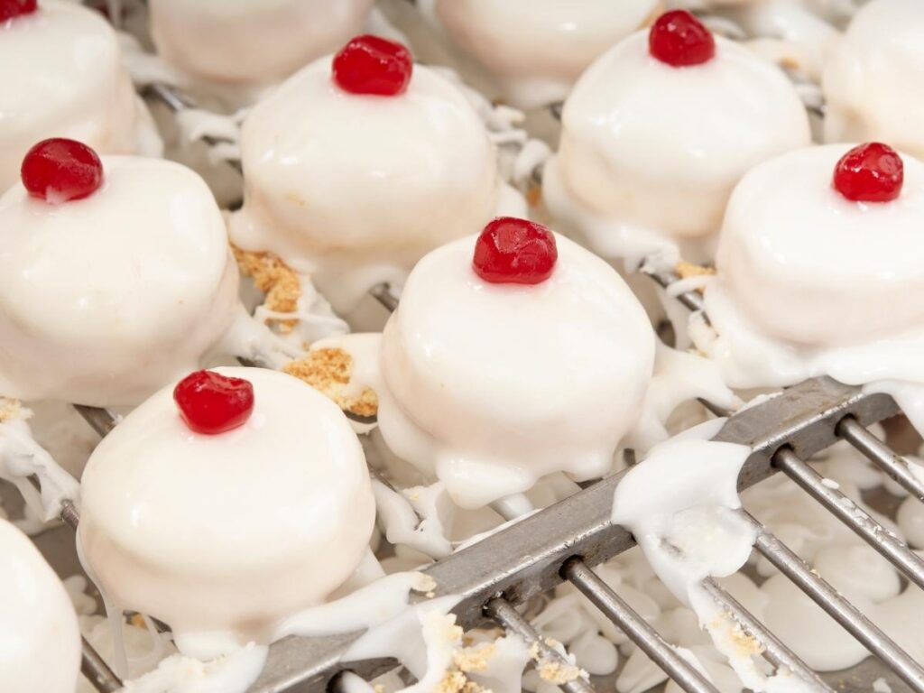 Delizia al limone pastry dusted with powdered sugar on a café table in Sorrento.