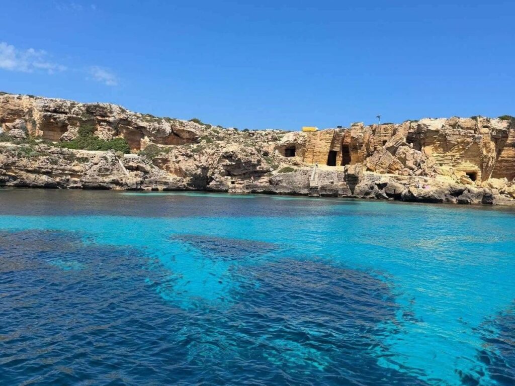 Crystal-clear turquoise water and rocky coves on Favignana Island in the Egadi archipelago near Sicily