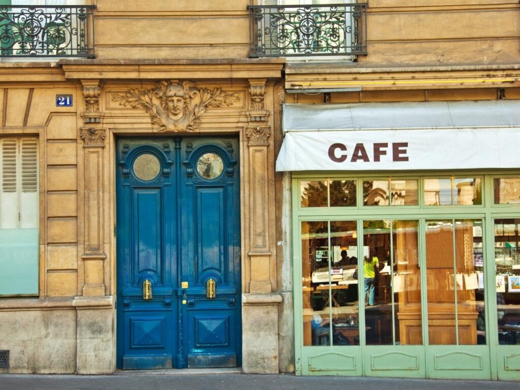 Leafy Gràcia square with locals drinking coffee