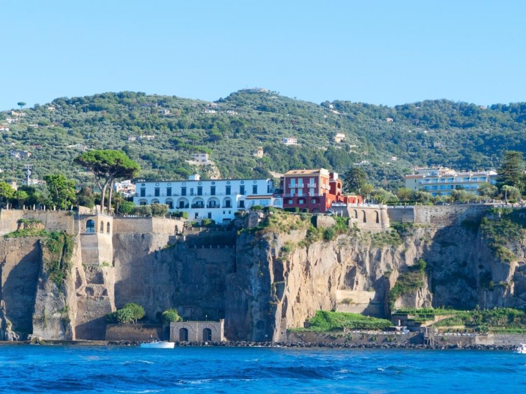 Elegant courtyard pool surrounded by lemon trees at Hotel Antiche Mura in central Sorrento.