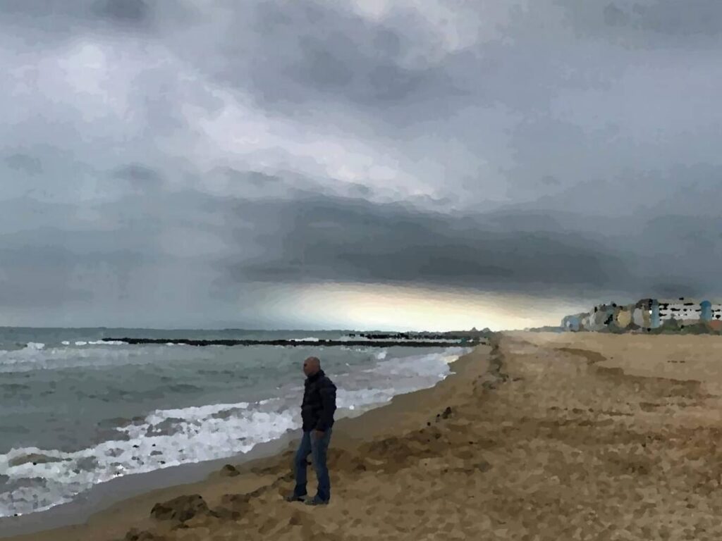 Early-morning Jesolo shoreline with a lone jogger and calm, glassy sea.”