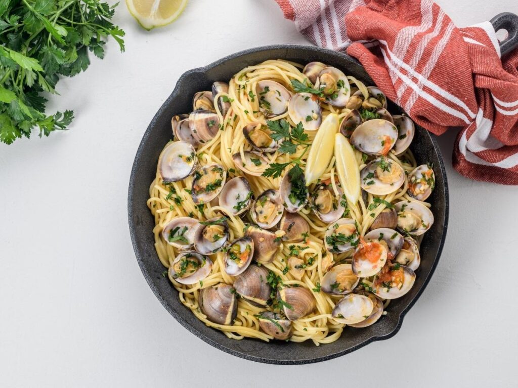 Spaghetti alle vongole served at a beachside trattoria in Jesolo