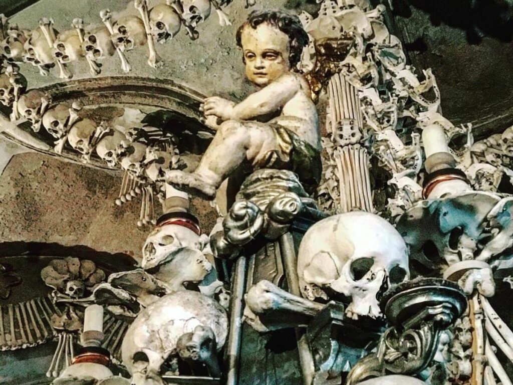 Interior of Sedlec Ossuary (Bone Church) near Kutná Hora showing decorative bone arrangement and Gothic architecture