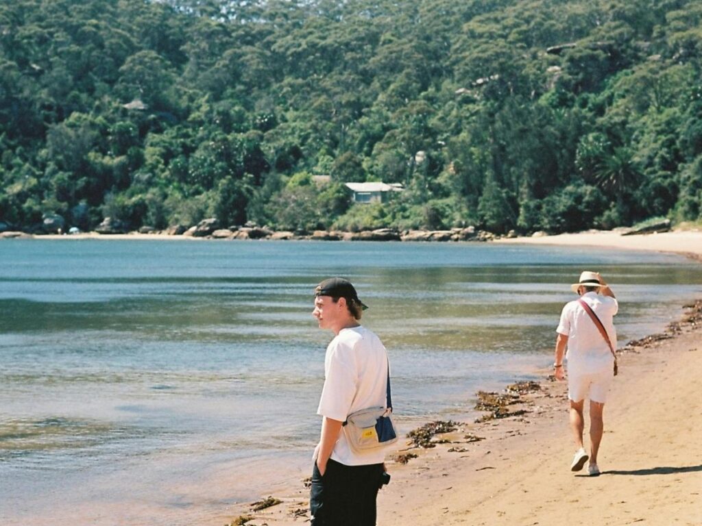 Early morning walk on Lignano Sabbiadoro beach with golden light and calm waves