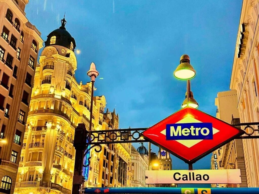 Madrid cityscape at night with Gran Vía lights and evening traffic