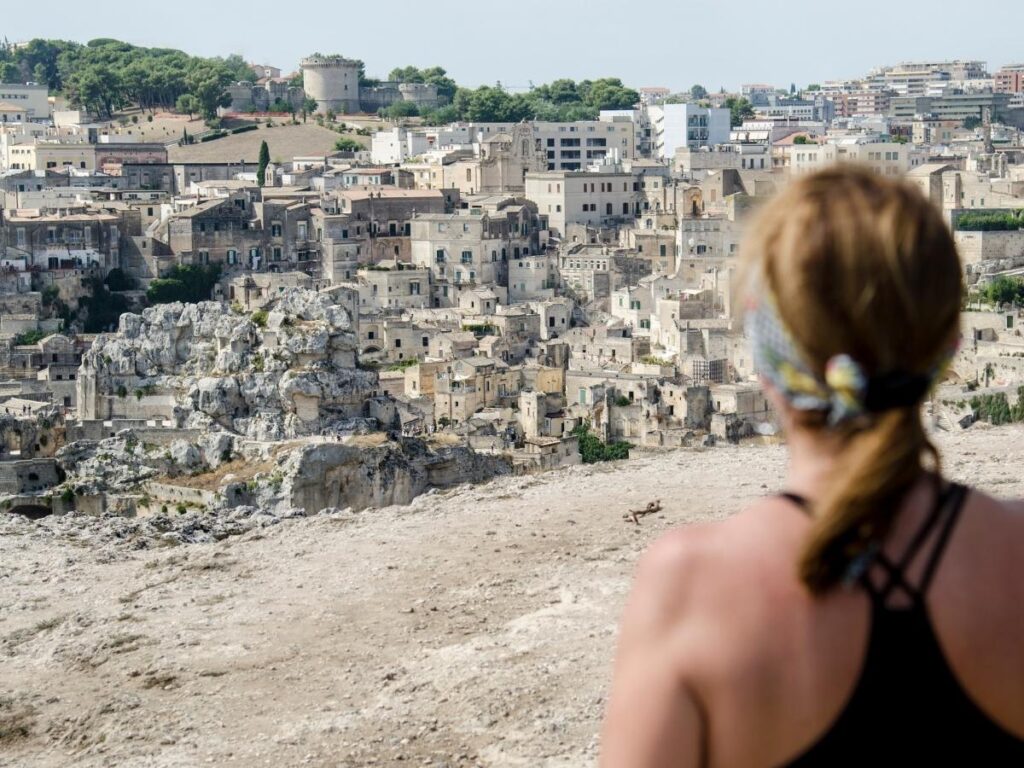 Early morning view of Matera’s Sassi with warm sunlight on the stone houses and quiet streets below.