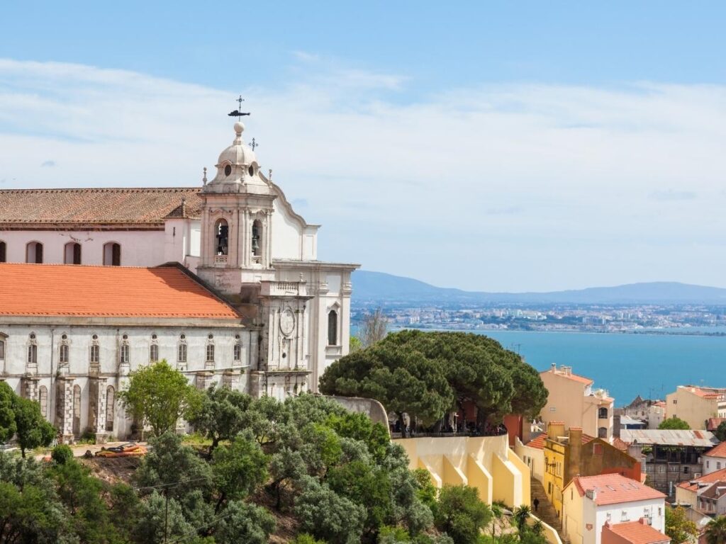 Panoramic view of Lisbon from Miradouro da Senhora do Monte at sunset.
